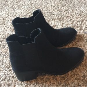 Black size 9.5 heeled ankle boots.